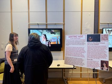 Ren Kosiorowski standing by their project, "Writing 400."